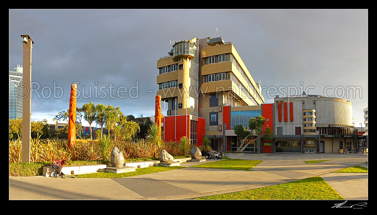 Image of Palmerston North City Council building in The Square, with large Maori carvings in the gardens. Panorama, Palmerston North, Palmerston North City District, Manawatu-Wanganui Region, New Zealand (NZ) stock photo image