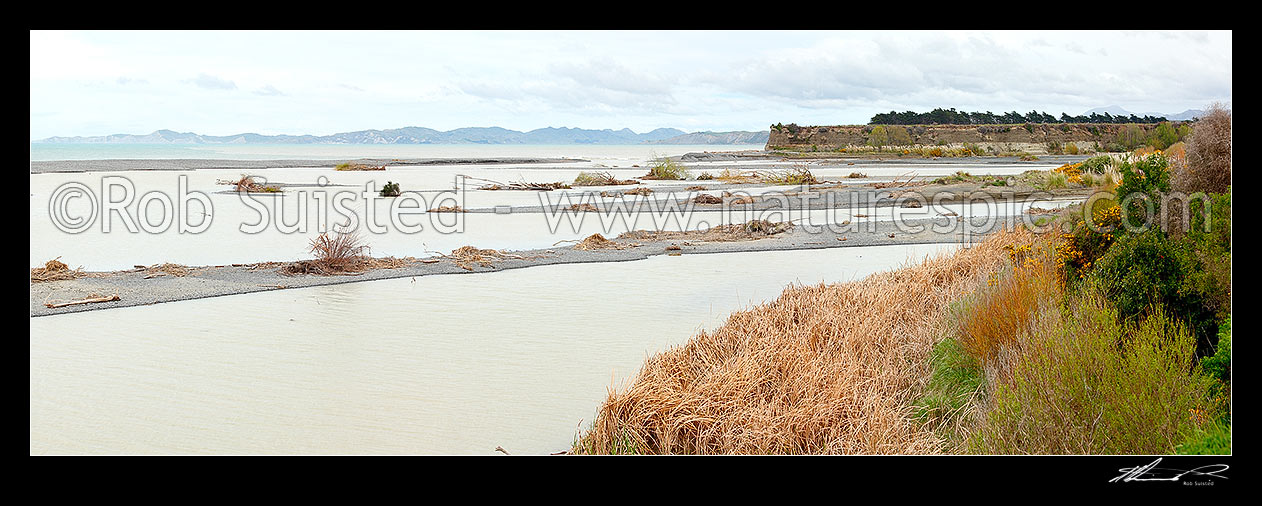 Image of Awatere River mouth and alluvial sand or gravel bars, with Clifford Bay and Cape Campbell beyond. Panorama, Seddon, Marlborough District, Marlborough Region, New Zealand (NZ) stock photo image