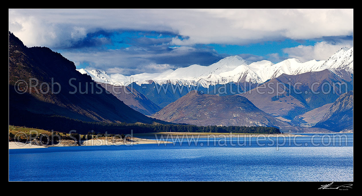 Image of Lake Hawea, looking past Bushy Point to the Dingle Burn (centre left), the Peninsula, Dingle Burn Station and Silver Island (right). Panorama, Lake Hawea, Otago, Queenstown Lakes District, Otago Region, New Zealand (NZ) stock photo image