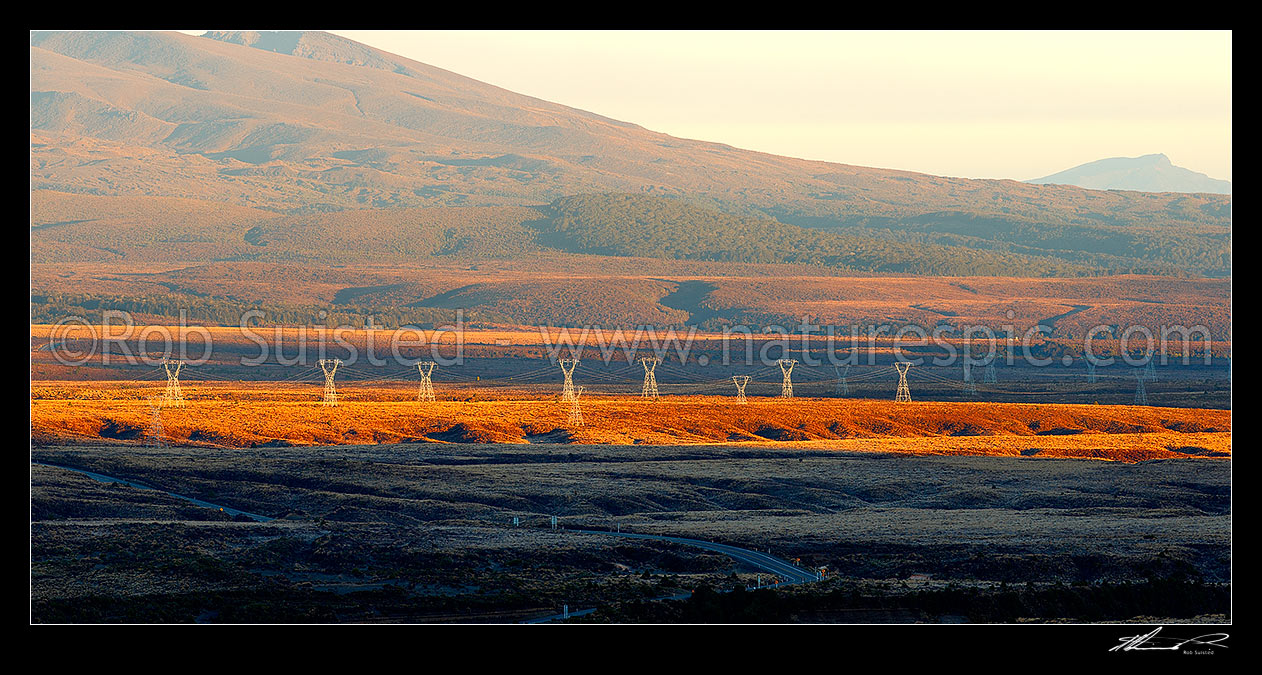 Image of Electricity power transmission lines and pylons crossing the Rangipo Desert, with the flanks of Mt Tongariro beyond. Panorama, Tongariro National Park, Taupo District, Waikato Region, New Zealand (NZ) stock photo image