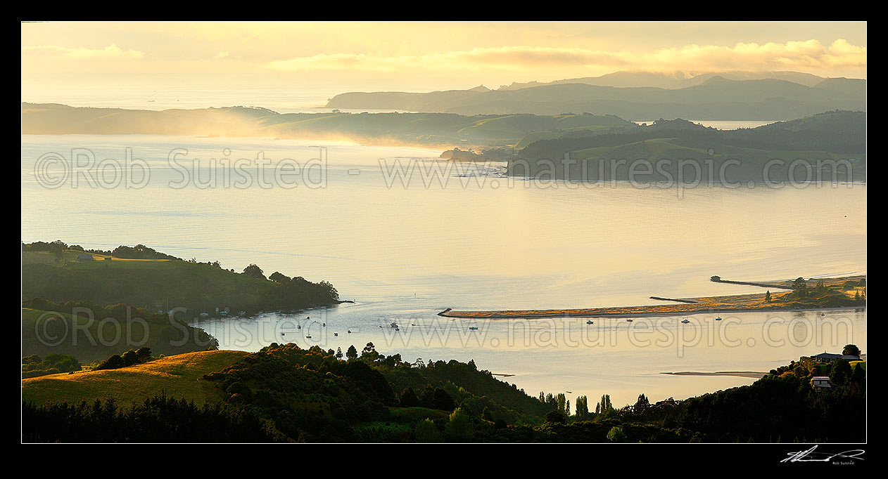 Image of Omaha Beach and Bay. Whangateau Harbour entrance, Ti Point and Tawharanui Peninsula at left with Kawau Island beyond, at dawn, Leigh, Rodney District, Auckland Region, New Zealand (NZ) stock photo image