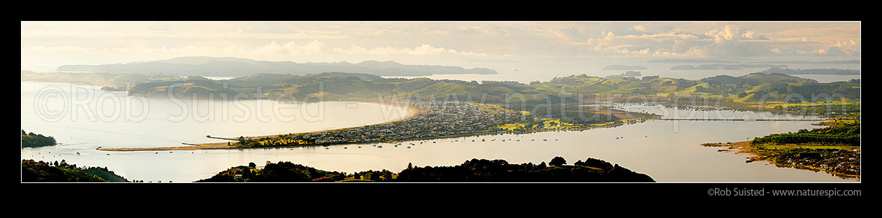 Image of Omaha Beach and Bay, Whangateau Harbour entrance, Ti Point and Tawharanui Peninsula at left with Kawau Island beyond, at dawn. Panorama, Omaha, Rodney District, Auckland Region, New Zealand (NZ) stock photo image