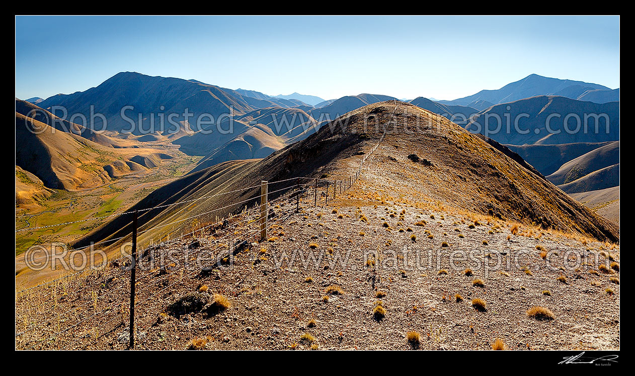 Image of Molesworth landscape, Guide River and Barefell Pass left, Half Moon Stream centre and Dillion Cone (2173m right). Panorama on high country fenceline, Molesworth Station, Marlborough District, Marlborough Region, New Zealand (NZ) stock photo image