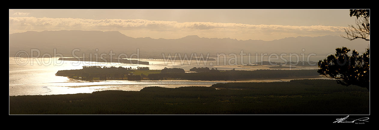 Image of Tauranga Harbour panorama with Matakana Island foreground, Rangiwaea Is. Centre, Motuhoa Is. left, and Kaimai Ranges behind, Mount Maunganui, Tauranga District, Bay of Plenty Region, New Zealand (NZ) stock photo image