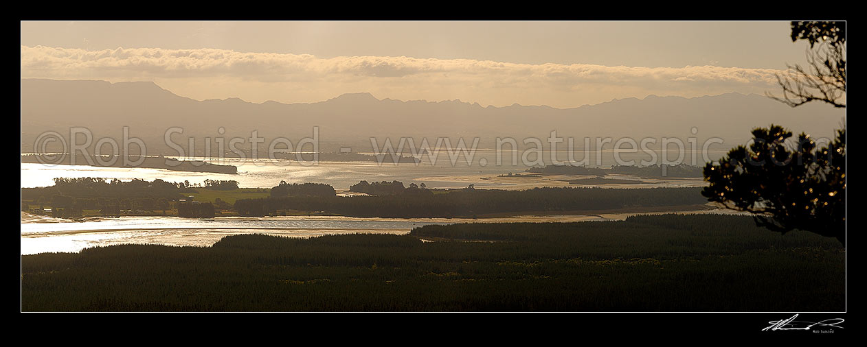 Image of Tauranga Harbour panorama with Matakana Island foreground, Rangiwaea Is. Centre, Motuhoa Is. left, and Kaimai Ranges behind, Mount Maunganui, Tauranga District, Bay of Plenty Region, New Zealand (NZ) stock photo image