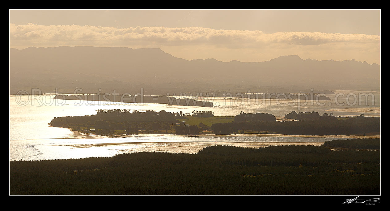 Image of Tauranga Harbour panorama with Matakana Island foreground, Rangiwaea Is. Centre, Motuhoa Is. left, and Kaimai Ranges behind, Mount Maunganui, Tauranga District, Bay of Plenty Region, New Zealand (NZ) stock photo image