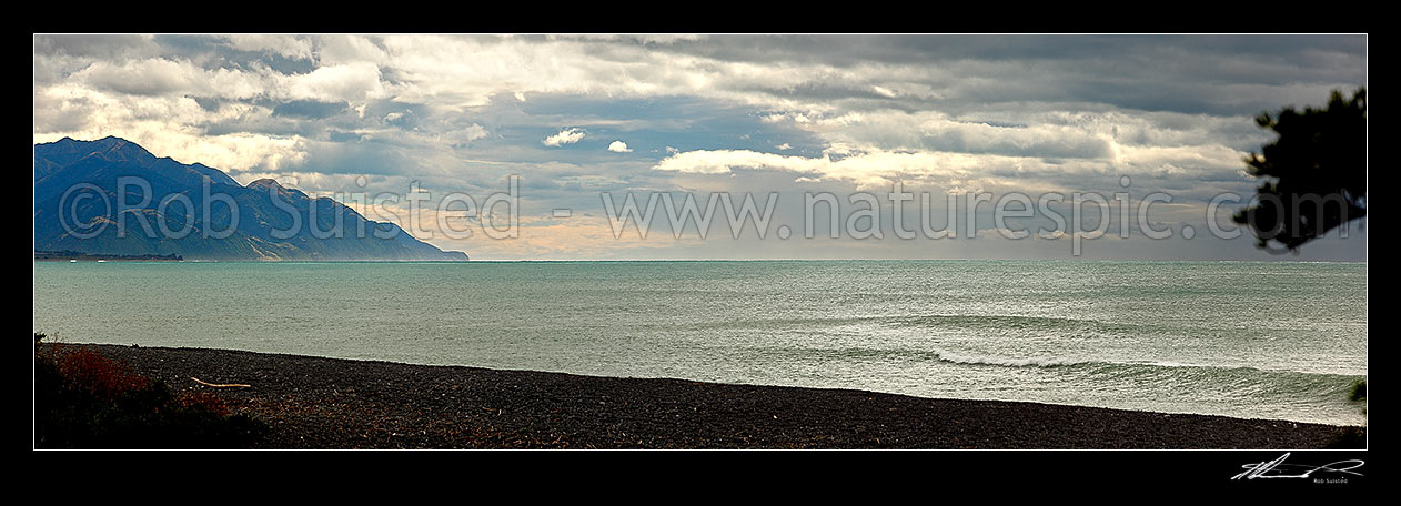 Image of Kaikoura coastline, looking north from the town Esplanade with breaking weather. Panorama, Kaikoura, Kaikoura District, Canterbury Region, New Zealand (NZ) stock photo image