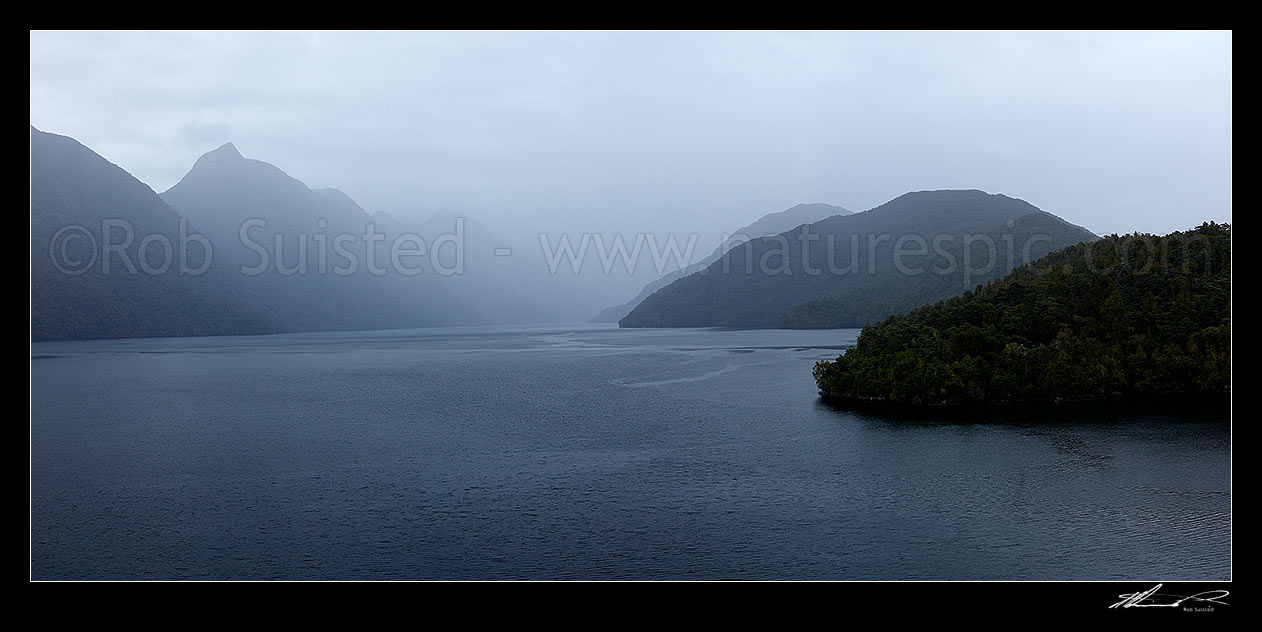 Image of Dusky Sound, looking down Cook Channel with Long Island at right. Mt Evans (1084m) at left. Panorama, Dusky Sound, Fiordland National Park, Southland District, Southland Region, New Zealand (NZ) stock photo image