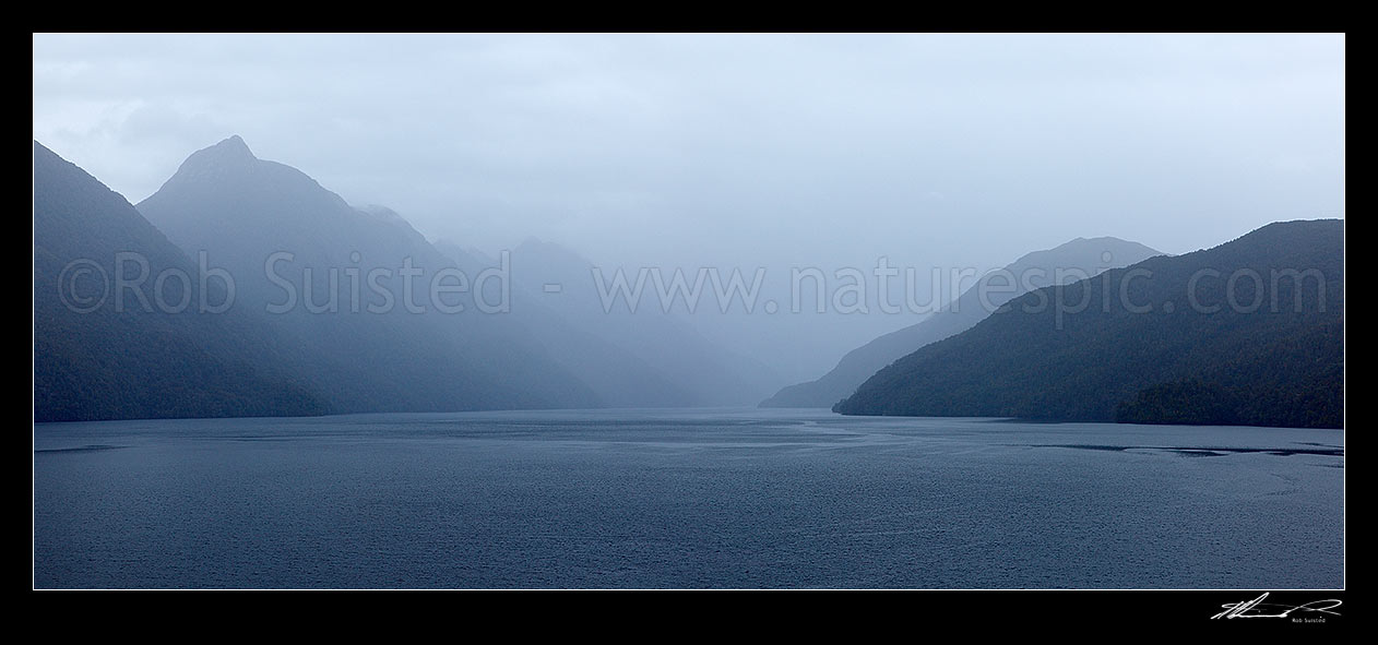 Image of Dusky Sound, looking down Cook Channel with Long Island at right. Mt Evans (1084m) at left. Panorama, Dusky Sound, Fiordland National Park, Southland District, Southland Region, New Zealand (NZ) stock photo image