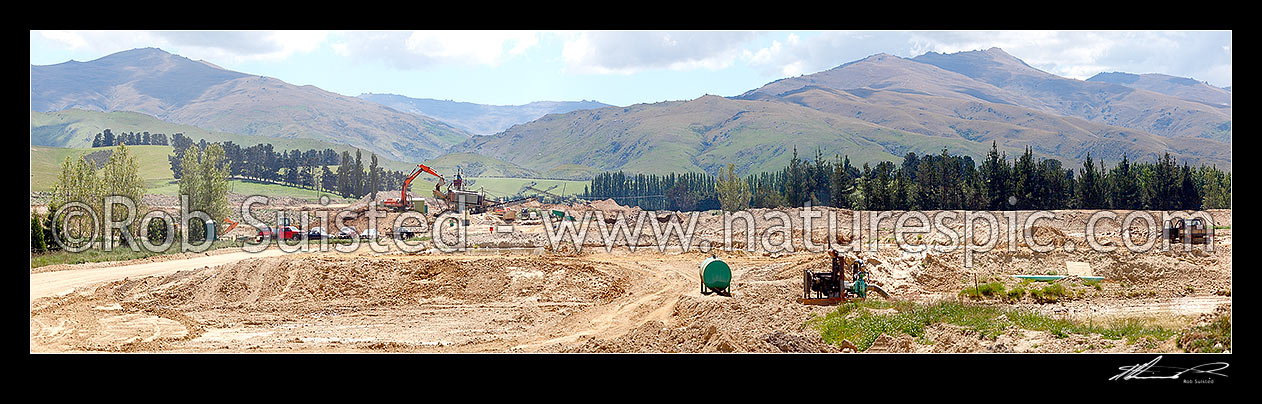 Image of Gold mining at Drybread Diggings with excavators and alluvial gold screens. Panorama, Drybread, Central Otago District, Otago Region, New Zealand (NZ) stock photo image