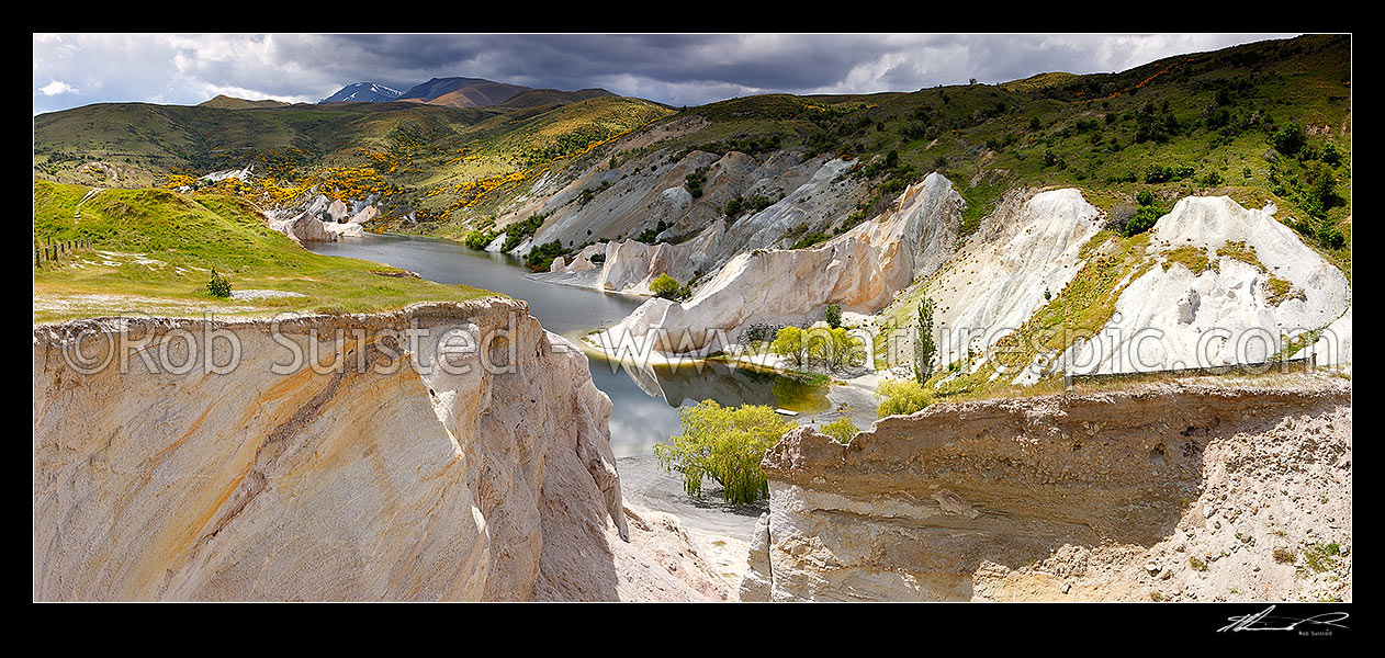 Image of Blue Lake at St Bathans, created by historical sluicings for gold mining. Panorama, Saint Bathans, Central Otago District, Otago Region, New Zealand (NZ) stock photo image