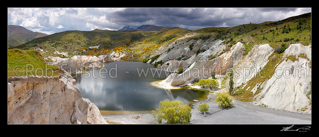 Image of Blue Lake at St Bathans, created by historical sluicings for gold mining. Panorama, Saint Bathans, Central Otago District, Otago Region, New Zealand (NZ) stock photo image