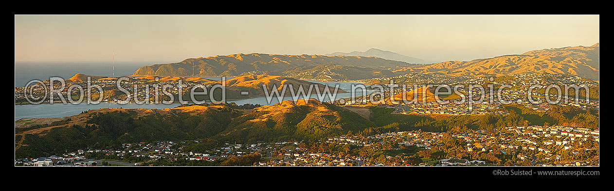 Image of Porirua City Harbour with Titahi Bay left, Plimmerton, Paremata, Camborne and Kapiti Island distant centre. Panorama, Porirua, Porirua City District, Wellington Region, New Zealand (NZ) stock photo image