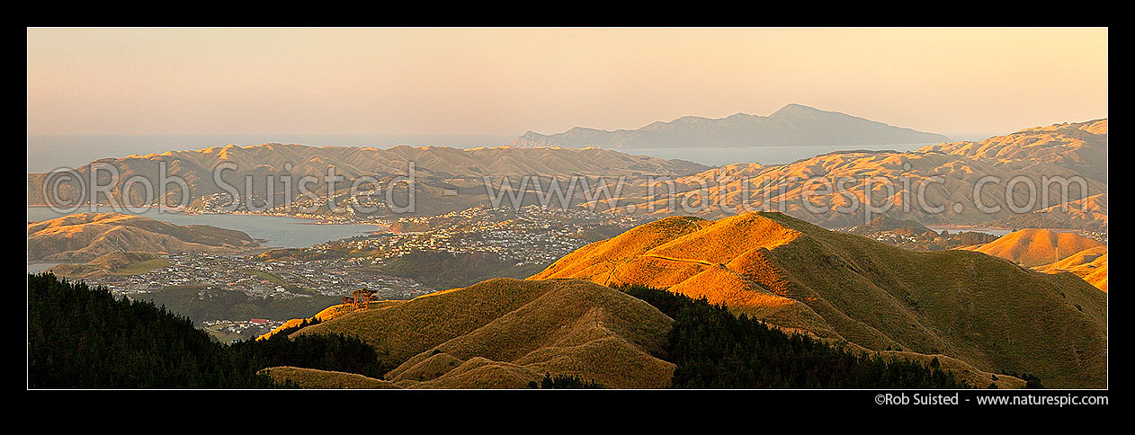 Image of Evening panorama over Porirua Harbour (left), Aotea, Paremata, Plimmerton, Pukerua bay, Kapiti Island (distant) and Pauatahanui Harbour (far right), Belmont Regional Park, Porirua City District, Wellington Region, New Zealand (NZ) stock photo image