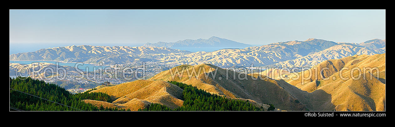 Image of Kapiti Island seen from Belmont Regional Park. Porirua Harbour and Plimmerton left, Pauatahanui Inlet right. Panorama, Belmont Regional Park, Porirua City District, Wellington Region, New Zealand (NZ) stock photo image