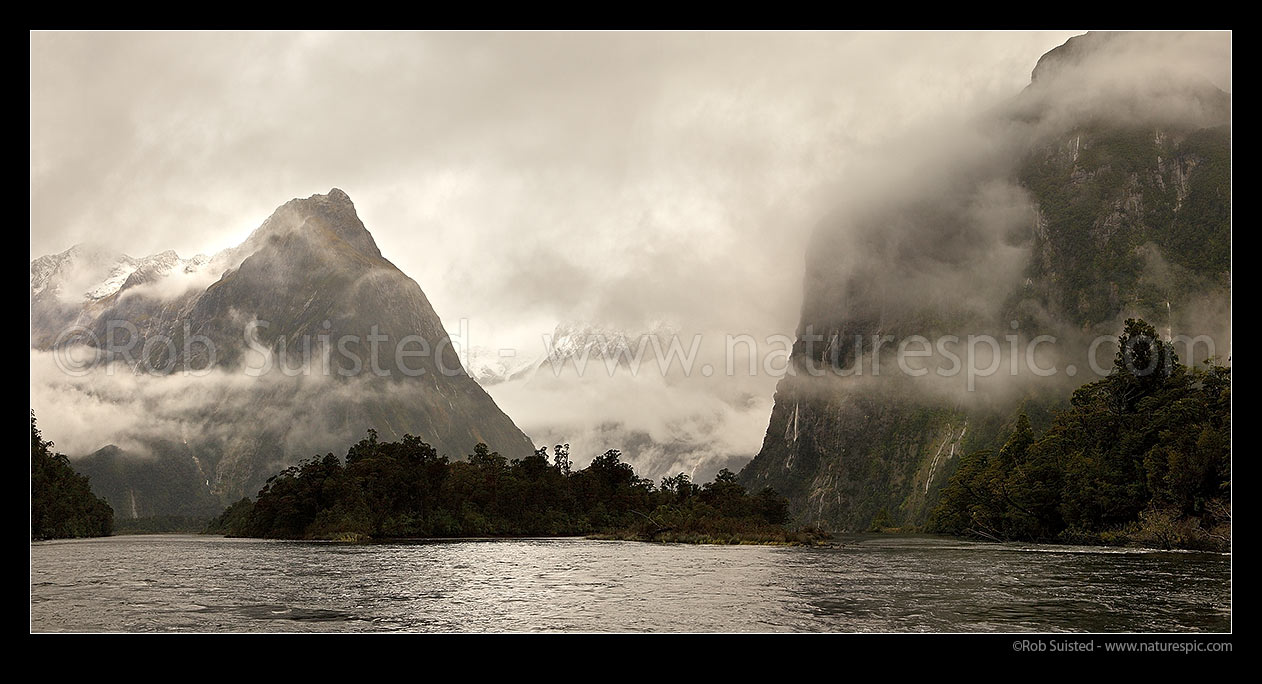 Image of Moody Milford Sound. Arthur River looking toward Barren Peak (1561m left), Darran Mountains & Cleddau Valley (centre), and Sheerdown Hills (right). Panorama, Milford Sound, Fiordland National Park, Southland District, Southland Region, New Zealand (NZ) stock photo image