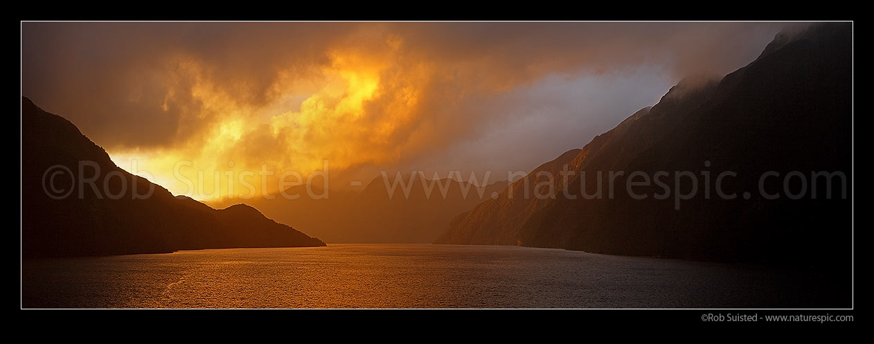 Image of Acheron Passage stormy sunset, looking towards Breaksea Sound. Resolution Island left. Panorama, Breaksea Sound, Fiordland National Park, Southland District, Southland Region, New Zealand (NZ) stock photo image