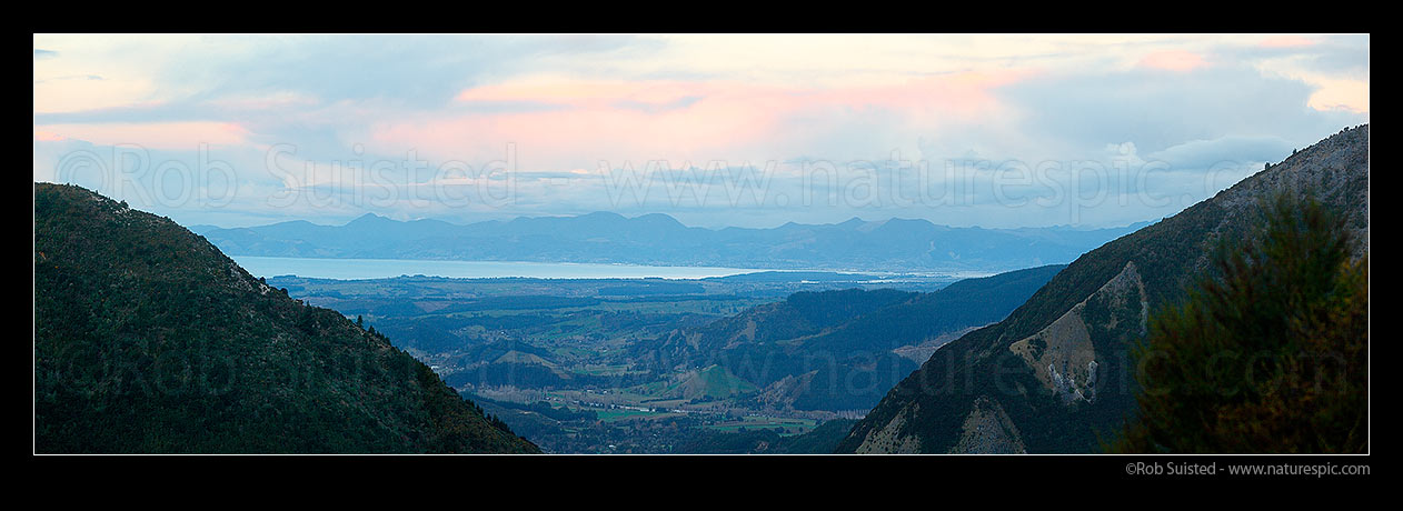 Image of Tasman Bay panorama on a cold winter evening from Kahurangi National Park. Looking over Upper Moutere towards Nelson and Richmond Range beyond, Motueka, Tasman District, Tasman Region, New Zealand (NZ) stock photo image