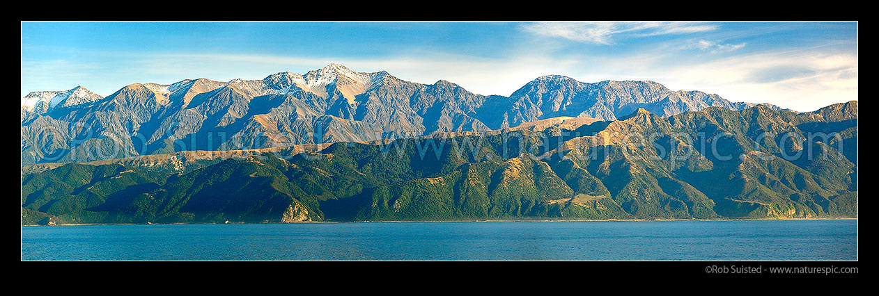 Image of Seaward Kaikoura Ranges, Mt Te ao Whekere (2590m centre left) and Mt Tarahaka (2283m centre right) towering high above Ohau and Paparoa Point on the Kaikoura Coast. Panorama, Kaikoura, Kaikoura District, Canterbury Region, New Zealand (NZ) stock photo image