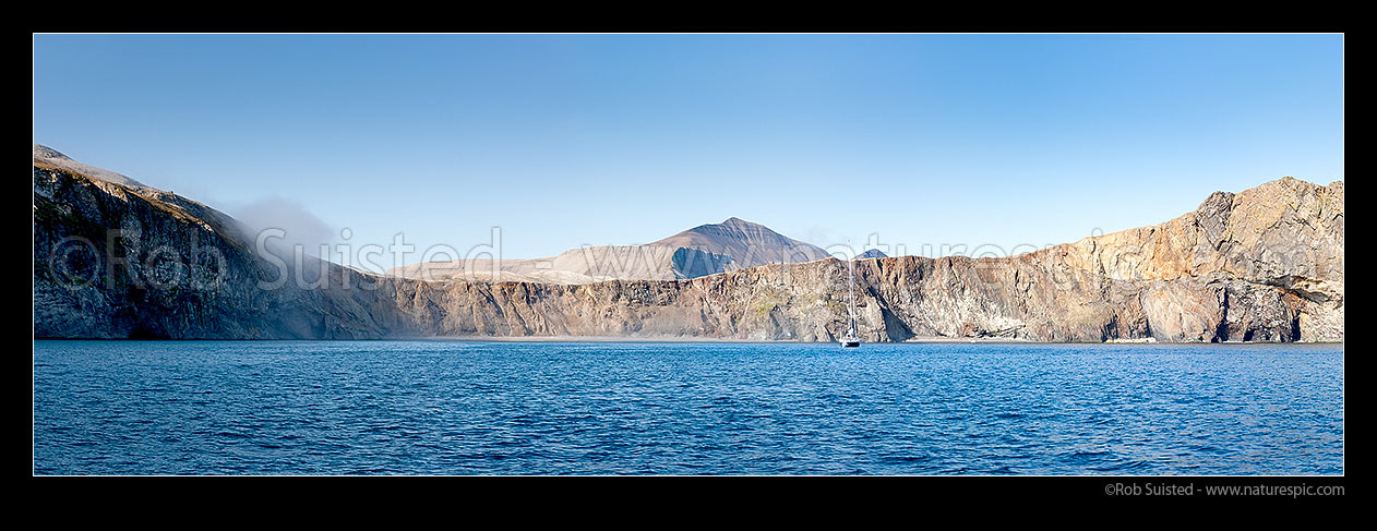 Image of Sailboat anchored in Sr-hamna harbour at Bear Island (Bjrnya). Mount Urd (535m) and Mt Skuld (454m) behind, southernmost island of the Svalbard archipelago. Panorama, Bear Island (Bjrnya), Svalbard stock photo image