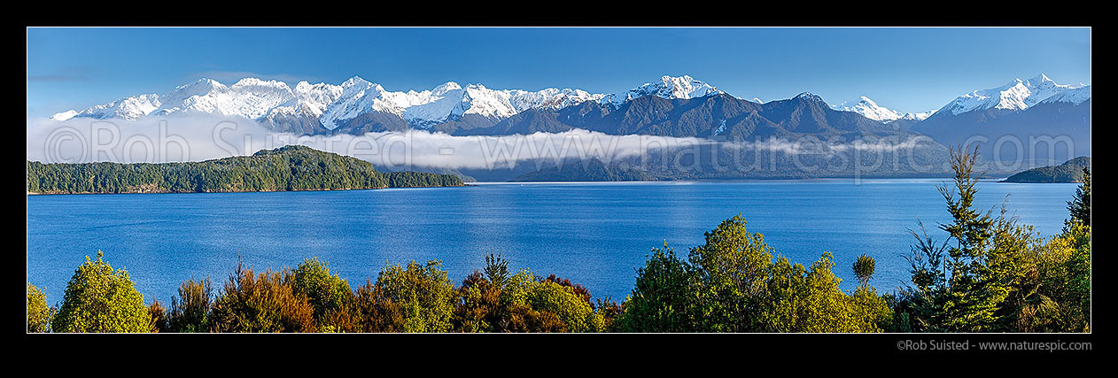 Image of Lake Manapouri and Kepler Mountains and Cathedral Peaks (left). Stony Point and Rona Island centre left. Iris Burn and Kepler Track far right. panorama, Manapouri, Fiordland National Park, Southland District, Southland Region, New Zealand (NZ) stock photo image