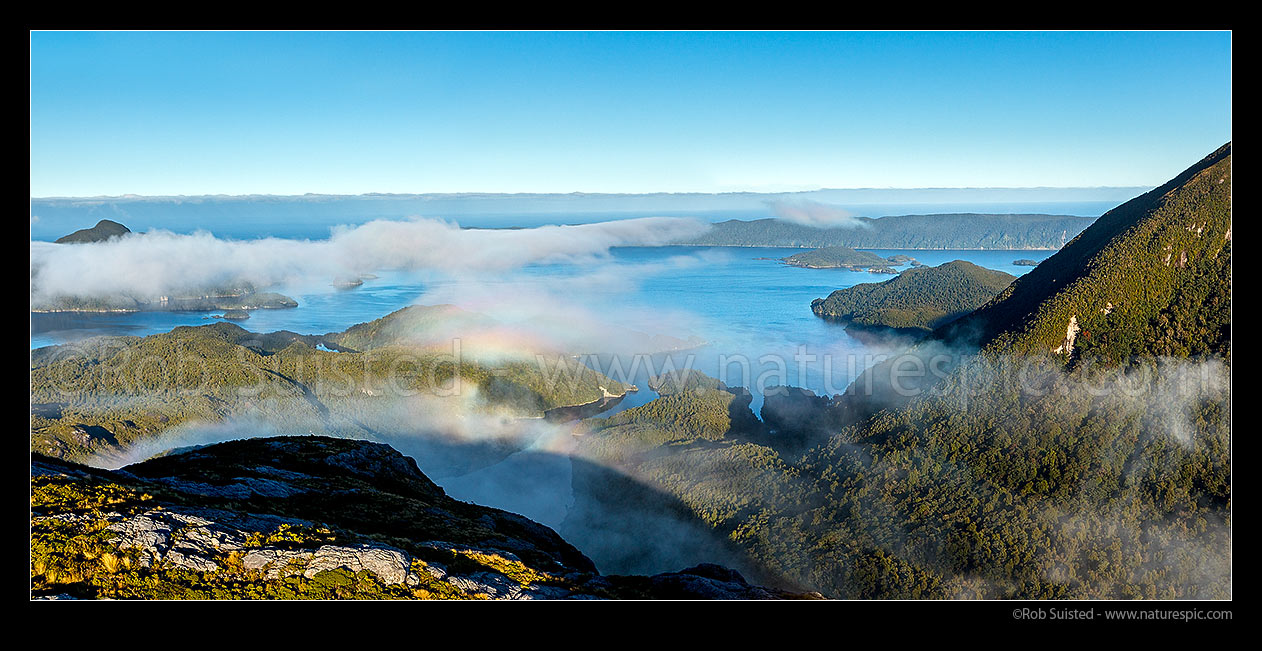 Image of Resolution Island in Dusky Sound, looking over Earshell Cove and The Basin. Five Fingers Peninsula, Parrot and Pigeon Island top right. Panorama, Dusky Sound, Fiordland National Park, Southland District, Southland Region, New Zealand (NZ) stock photo image