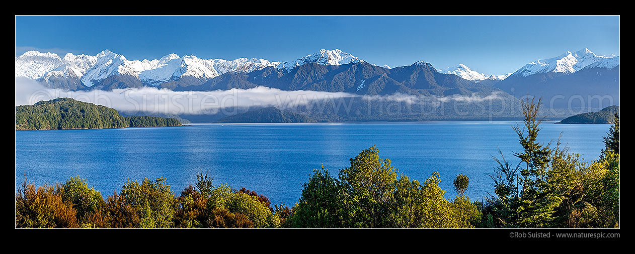 Image of Lake Manapouri and Kepler Mountains and Cathedral Peaks (left). Stony Point and Rona Island centre left. Iris Burn and Kepler Track far right. panorama, Manapouri, Fiordland National Park, Southland District, Southland Region, New Zealand (NZ) stock photo image