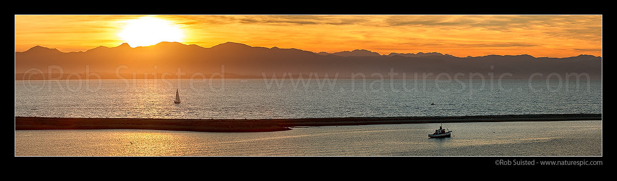 Image of Sunseting over Nelson Haven, Boulder Bank, Tasman Bay and distant Kahurangi National Park Mountains. Panorama, Nelson, Nelson City District, Nelson Region, New Zealand (NZ) stock photo image