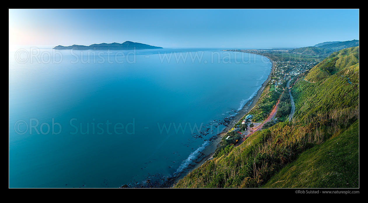 Image of Kapiti Island seen from Paekakariki Hill at dusk. Rauoterangi Channel and Otaheke Strait separate the island from Paraparaumu Beach. Panorama, Paekakariki, Kapiti Coast District, Wellington Region, New Zealand (NZ) stock photo image