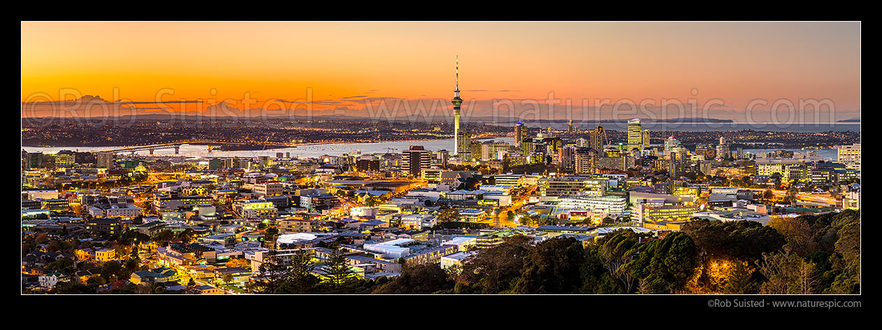 Image of Auckland city at dusk. Auckland Harbour Bridge far left, Sky Tower left and Hauraki Gulf far right. Very large panorama, Auckland, Auckland City District, Auckland Region, New Zealand (NZ) stock photo image