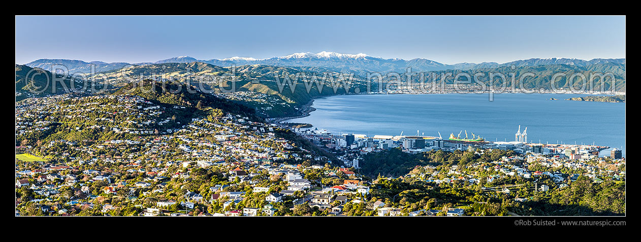 Image of Wellington and Hutt Valley winter with snowy Tararua Ranges beyond. Karori, Wadestown, Thorndon and Kaiwharawhara in foreground, Johnsonville left, Hutt City, Petone and Remutaka (Rimutaka) Ranges at right. Panorama, Wellington, Wellington City District, Wellington Region, New Zealand (NZ) stock photo image