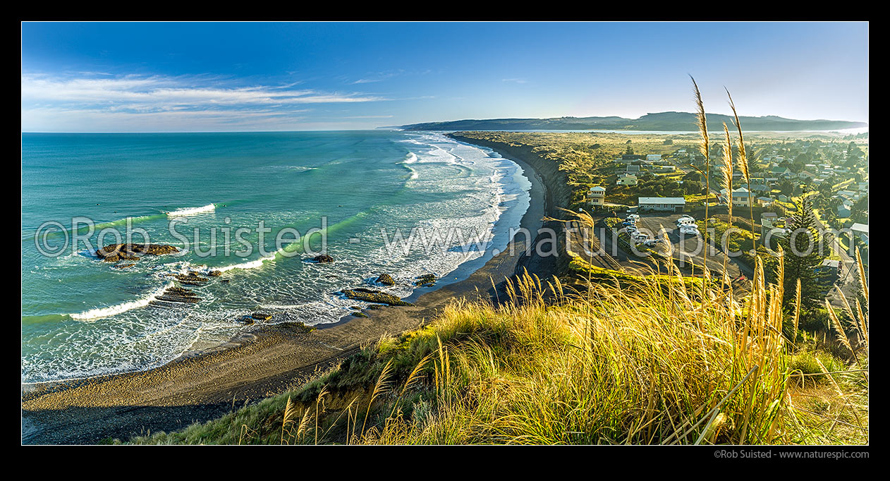 Image of Port Waikato Beach and township panorama. Waikato River mouth beyond, Port Waikato, Franklin District, Waikato Region, New Zealand (NZ) stock photo image