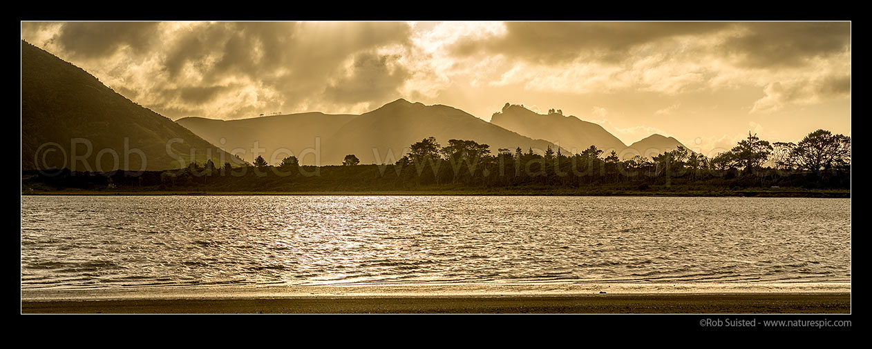 Image of Whangape Harbour on a stormy moody evening. Panorama. Proctor Peninsula in foreground, Pawarenga, Far North District, Northland Region, New Zealand (NZ) stock photo image