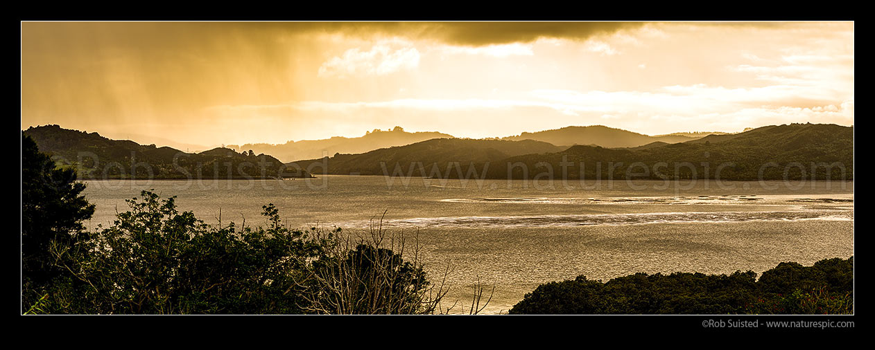 Image of Hokianga Harbour on a stormy raining evening. Looking towards The Narrows at Rangiora. Panorama, Rawene, Hokianga, Far North District, Northland Region, New Zealand (NZ) stock photo image