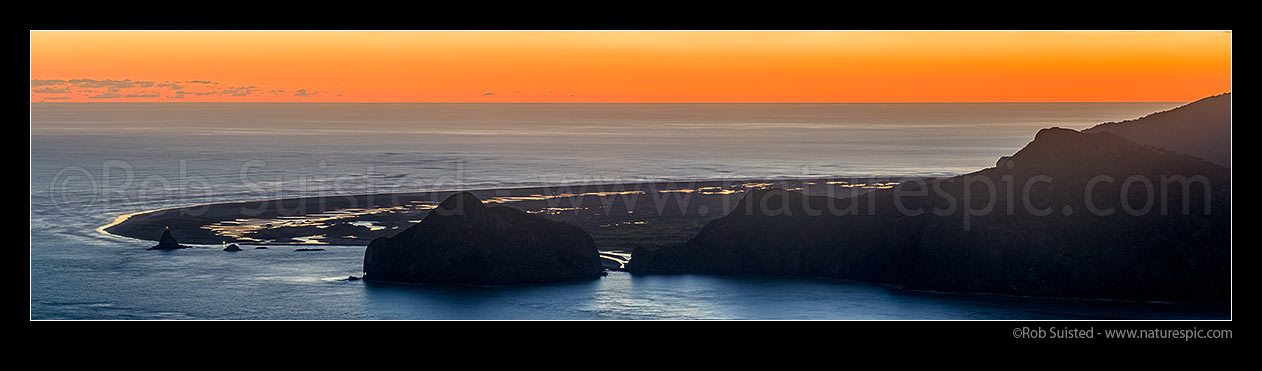 Image of Whatipu Beach and Manukau Harbour entrance panorama at sunset. Ninepin Rock light left and Paratutae Island centre. Wongawonga Bay right, Whatipu, Waitakere City District, Auckland Region, New Zealand (NZ) stock photo image