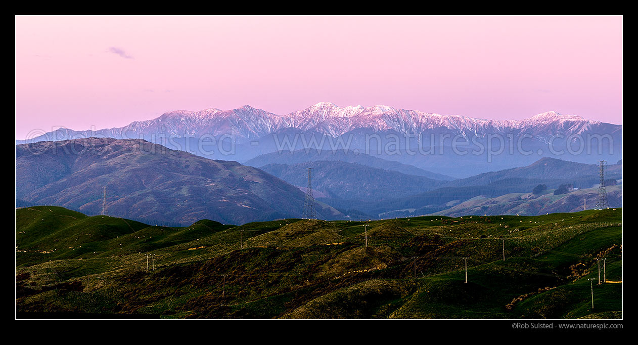 Image of Tararua Ranges, Southern Main Range. Mt Hector (1529m) centre. Seen from Porirua, at sunset with winter snow, Tararua Forest Park, Porirua City District, Wellington Region, New Zealand (NZ) stock photo image