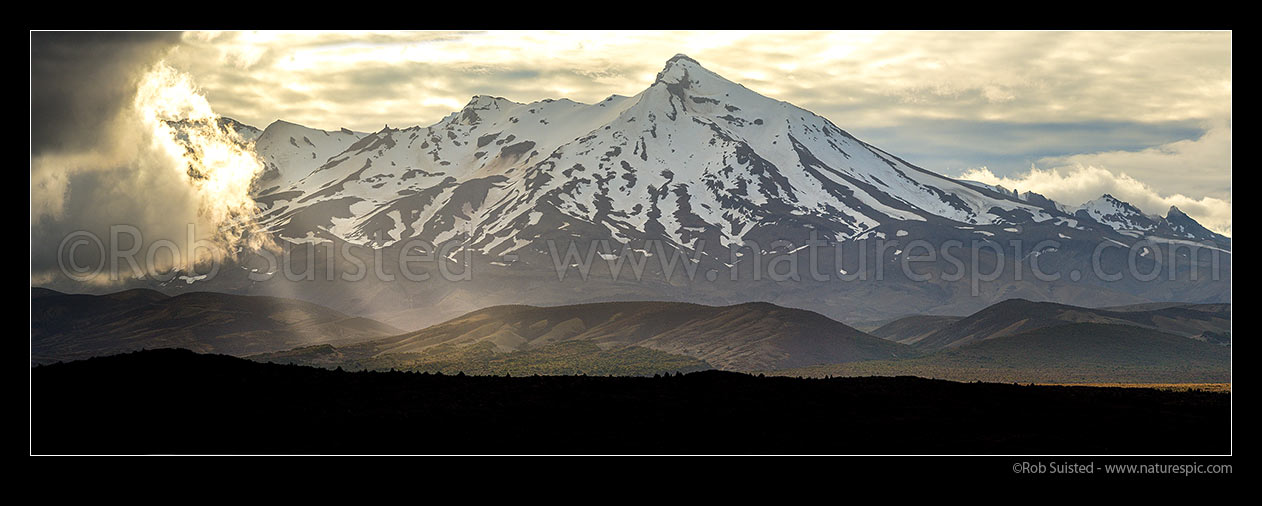 Image of Mt Ruapehu (2797m) with storm weather gathering from the South. Rangipo Desert and Desert Road. Seen from SH1. Tongariro National Park, Waiouru, Ruapehu District, Manawatu-Wanganui Region, New Zealand (NZ) stock photo image