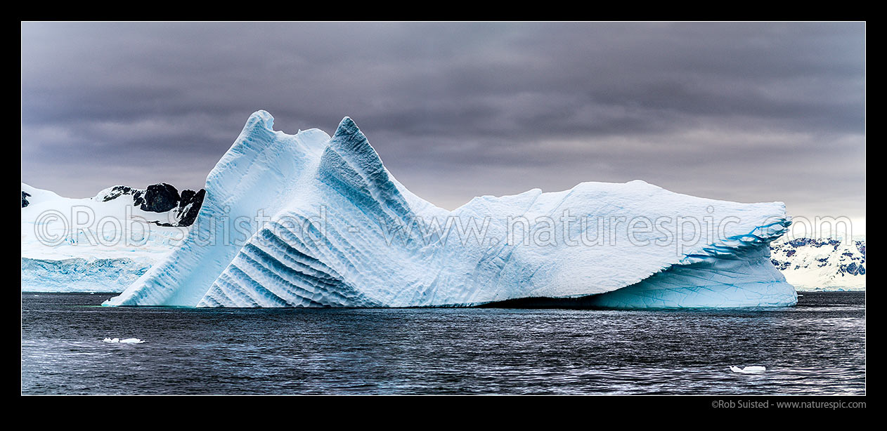 Image of Iceberg sculptured by water, and ground in the Gerlache Strait. Panorama, Antarctic Peninsula, Antarctica Region, Antarctica stock photo image