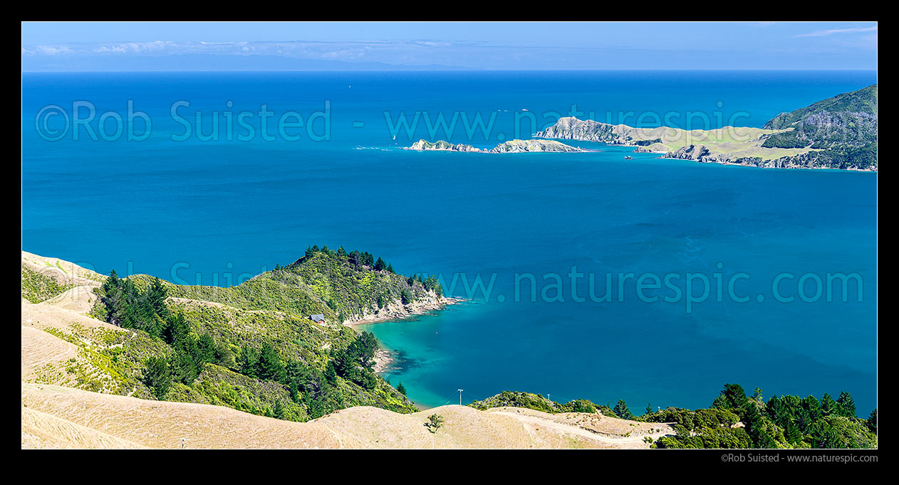 Image of Tasman Bay seen from French Pass above Camp Bay. Sailboat passing Le Brun Peninsula, Hautai Island and D'Urville Island. Separation Point is distance. Panorama, French Pass, Marlborough Sounds, Marlborough District, Marlborough Region, New Zealand (NZ) stock photo image