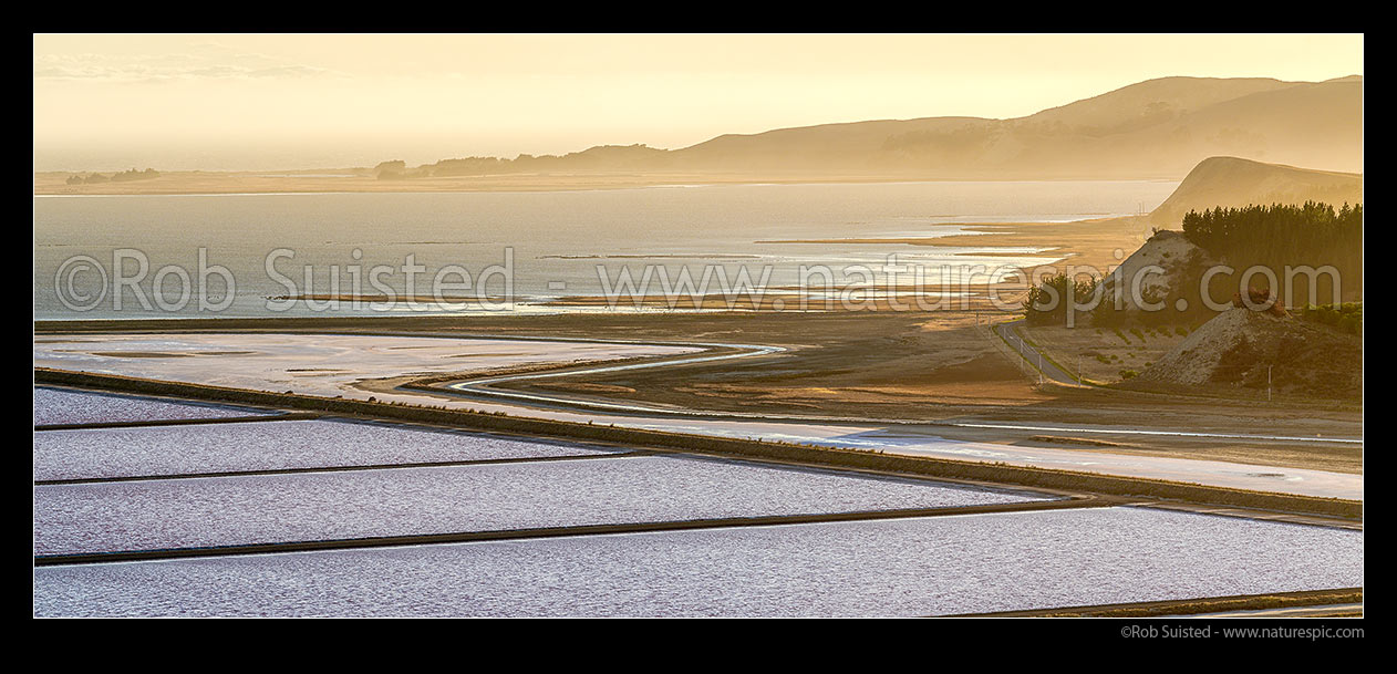 Image of Lake Grassmere / Kapara Te Hau, with Saltworks ponds in foreground. Marfells Beach Road right. Hauwai panorama, Lake Grassmere, Marlborough District, Marlborough Region, New Zealand (NZ) stock photo image