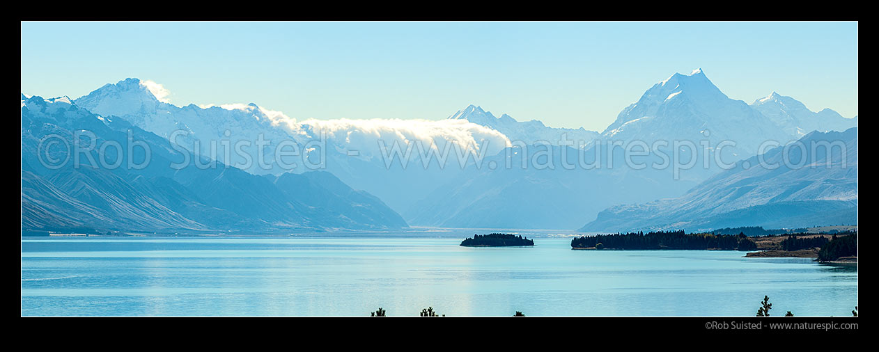 Image of Aoraki Mt Cook (3754m, at right) above Lake Pukaki. Tasman Valley above Morgans Island.  Mt La Perouse (3078m) centre, and Mt Sefton left (3151m). Panorama, Aoraki / Mount Cook National Park, MacKenzie District, Canterbury Region, New Zealand (NZ) stock photo image