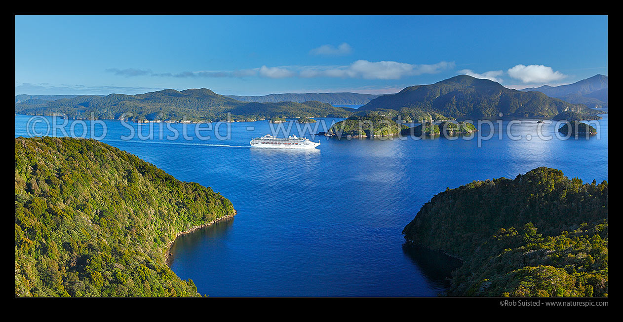 Image of Cruise ship entering Dusky Sound. Anchor Island behind. Panorama, Fiordland National Park, Southland District, Southland Region, New Zealand (NZ) stock photo image