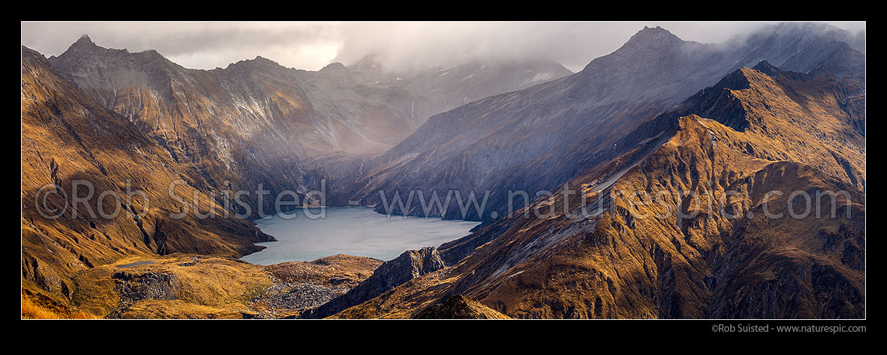 Image of Lochnagar (Lake Lochnagar) above the Shotover River, in the Richardson Mountains and Shotover Conservation Area. Cleft Peak (2250) in cloud. Panorama, Shotover River, Queenstown Lakes District, Otago Region, New Zealand (NZ) stock photo image