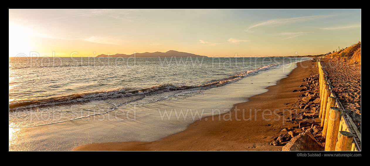 Image of Paekakariki's Whareroa Beach and Kapiti Island at sunset. Panorama, Paekakariki, Kapiti Coast District, Wellington Region, New Zealand (NZ) stock photo image