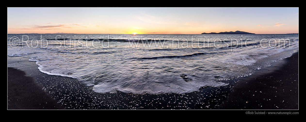 Image of Paekakariki Beach sunset panorama. South Island left distance, with Kapiti Island and Paraparaumu Beach at right, Paekakariki, Kapiti Coast District, Wellington Region, New Zealand (NZ) stock photo image