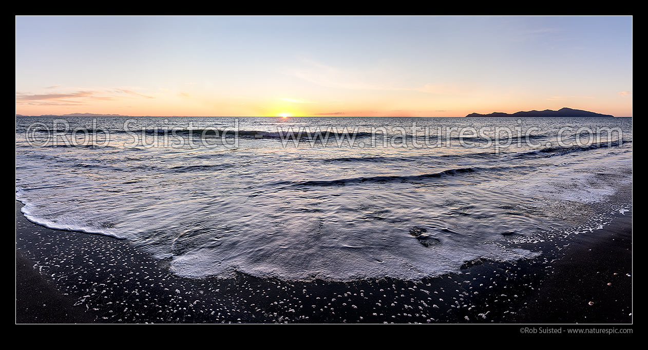 Image of Paekakariki Beach sunset panorama. South Island left distance, with Kapiti Island at right, Paekakariki, Kapiti Coast District, Wellington Region, New Zealand (NZ) stock photo image