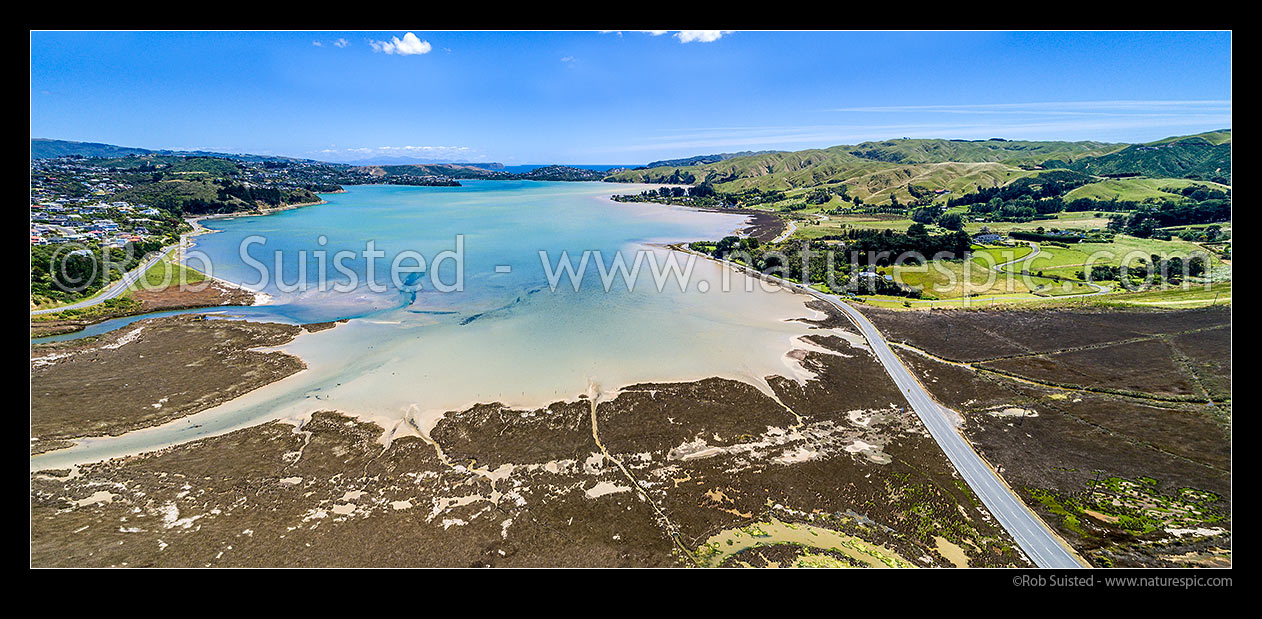 Image of Pauatahanui Inlet of Porirua Harbour from air. Pauatahanui Stream and Whitby far left, Wildlife Reserve below, and Grays Road, Ration Point right. Aerial view panorama, Pauatahanui, Porirua City District, Wellington Region, New Zealand (NZ) stock photo image