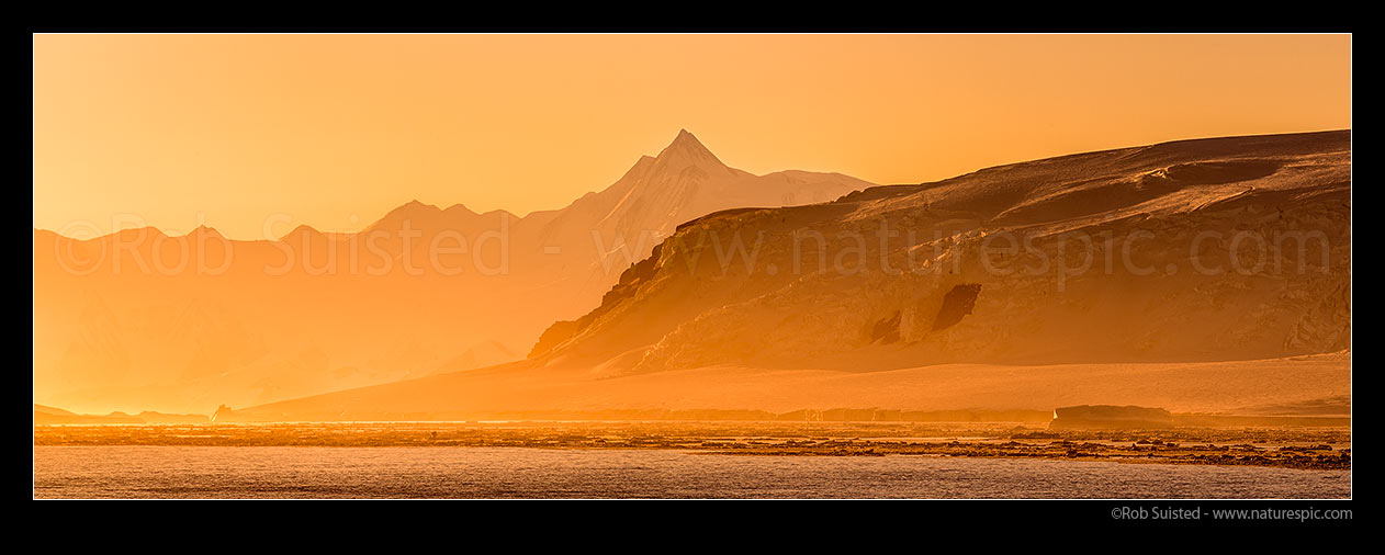 Image of Mount Herschel (3335m) standing in the Admiralty Mountains, and above Cape Roget on the Adare Peninsula at twilight. First climbed in 1967 by Sir Ed Hillary. Victoria Land. Panorama, Ross Sea, Antarctica Region, Antarctica stock photo image