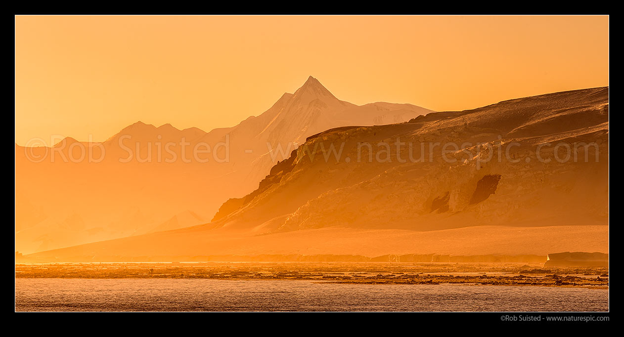 Image of Mount Herschel (3335m) standing in the Admiralty Mountains, and above Cape Roget on the Adare Peninsula at twilight. First climbed in 1967 by Sir Ed Hillary. Victoria Land. Panorama, Ross Sea, Antarctica Region, Antarctica stock photo image