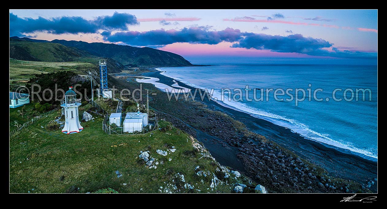 Image of Baring Head lighthouse on cliffs above Baring Head. Wainuiomata River mouth and Turakirae Head beyond. Aerial panorama view at dusk, Baring Head, Hutt City District, Wellington Region, New Zealand (NZ) stock photo image